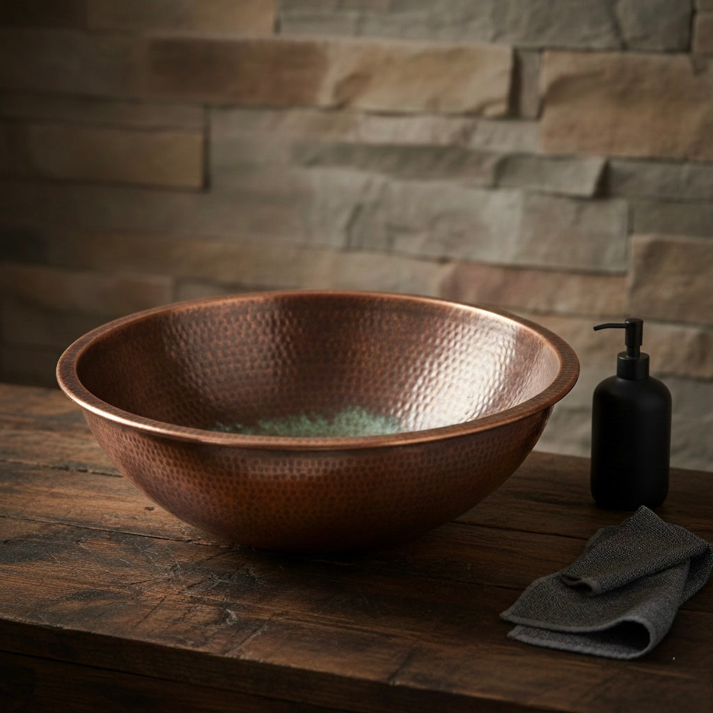 Moroccan artisan handcrafting a copper sink in traditional workshop
