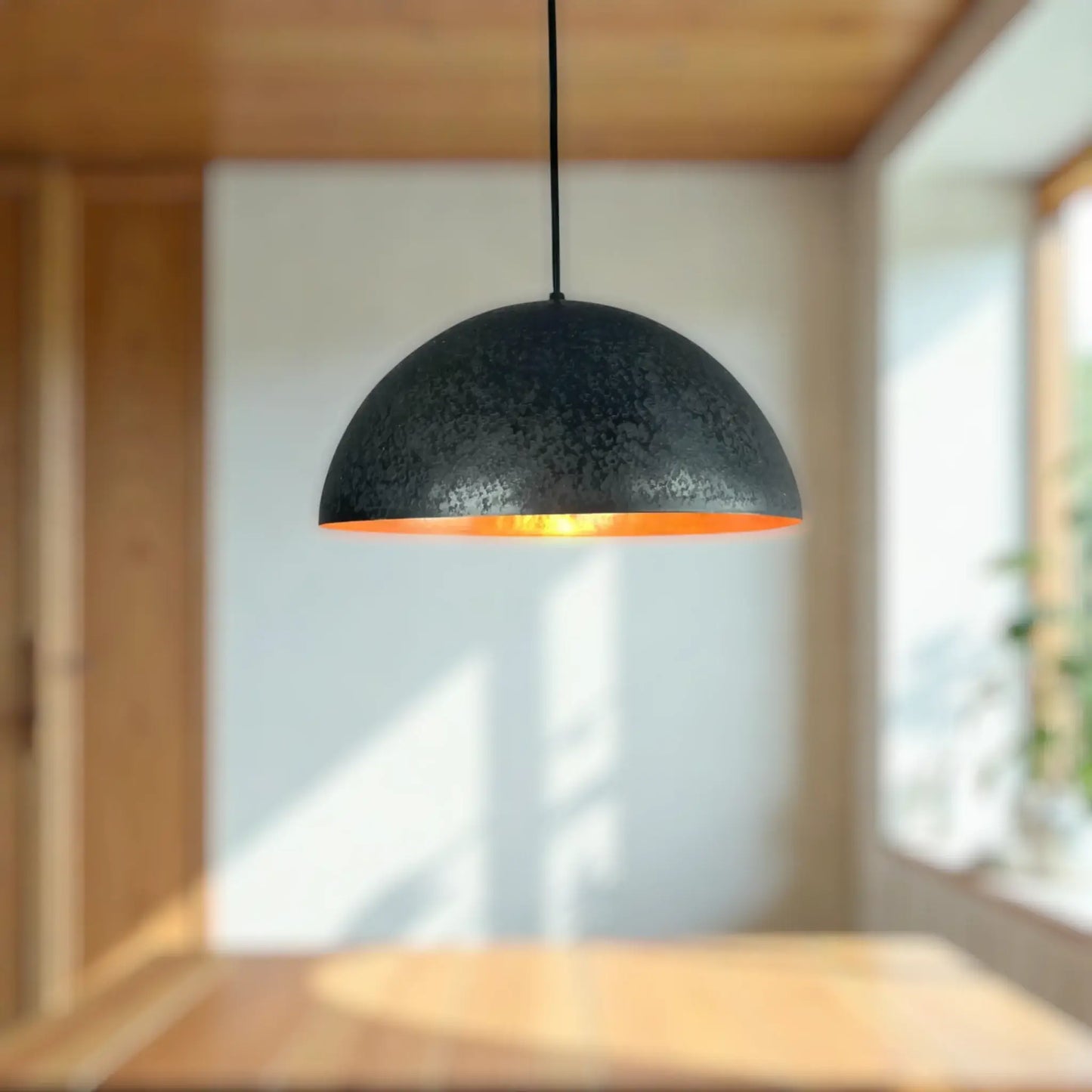 Copper Dome Lamp hanging in a modern interior, featuring a stylish black and orange design.