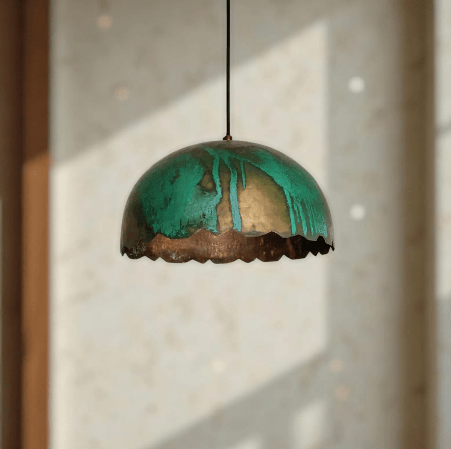 Green Patina Scalloped Copper Dome Pendant Light hanging in a bright room, showcasing its unique patina finish.