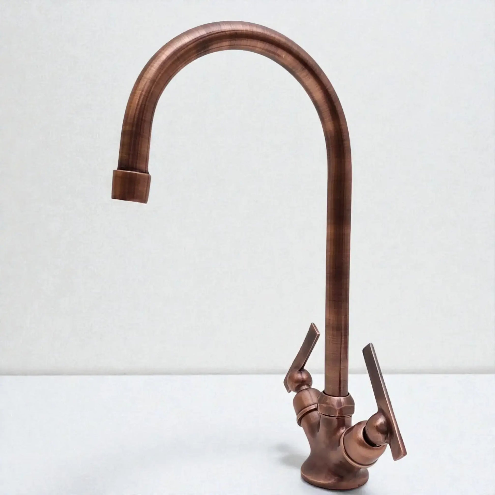 Bronze kitchen faucet on a white background
