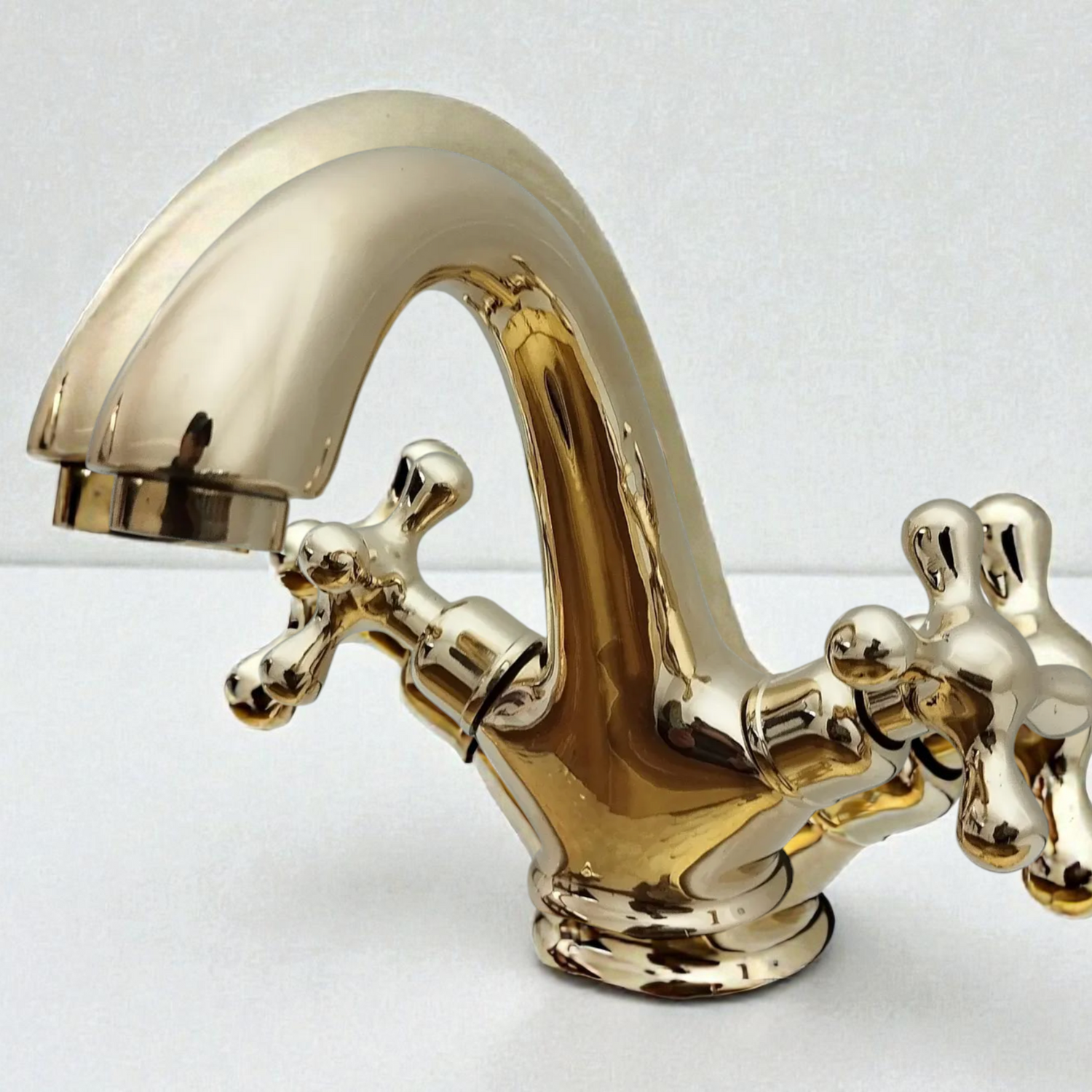 Gold faucet on a white background