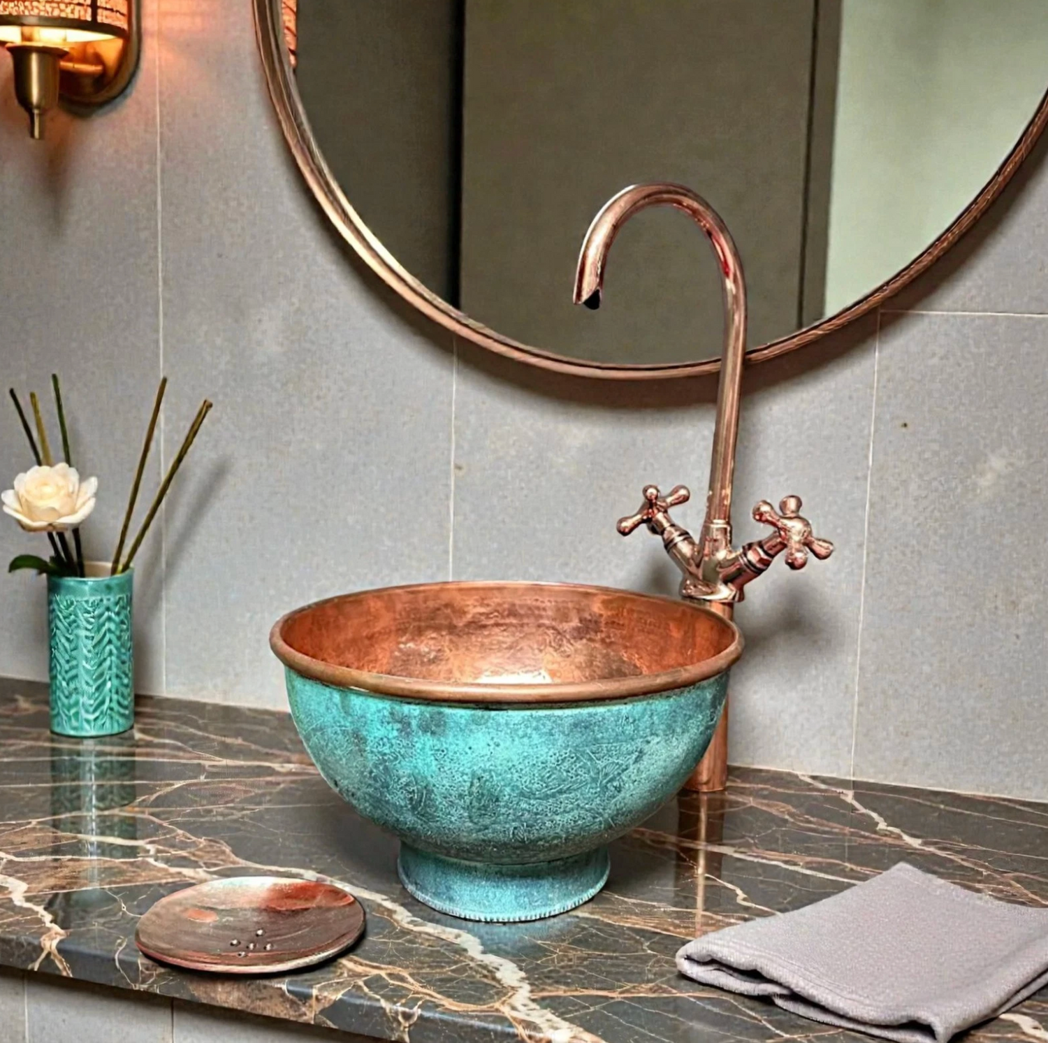 Handcrafted pedestal green patina copper vessel sink with hammered copper interior on marble countertop
