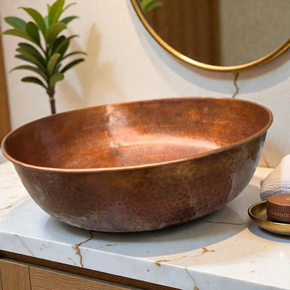 Round hammered copper vessel sink