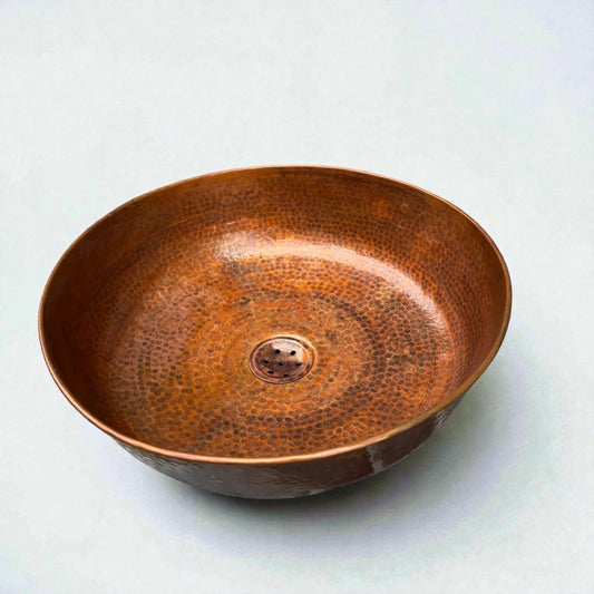 Round hammered copper vessel sink